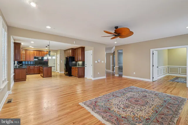 a view of a hallway with chandelier and front door