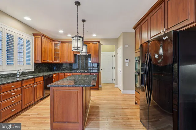 a view of a room with wooden floor and window