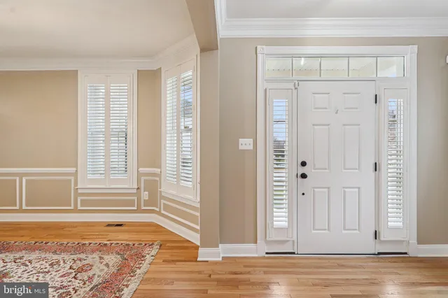 a view of a room with wooden floor and stairs
