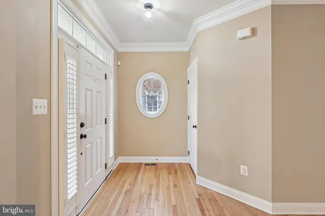a view of an empty room and wooden floor
