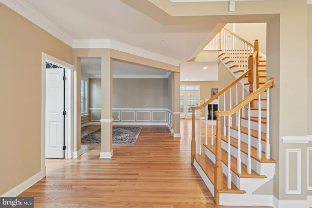 a view of an entryway with wooden floor