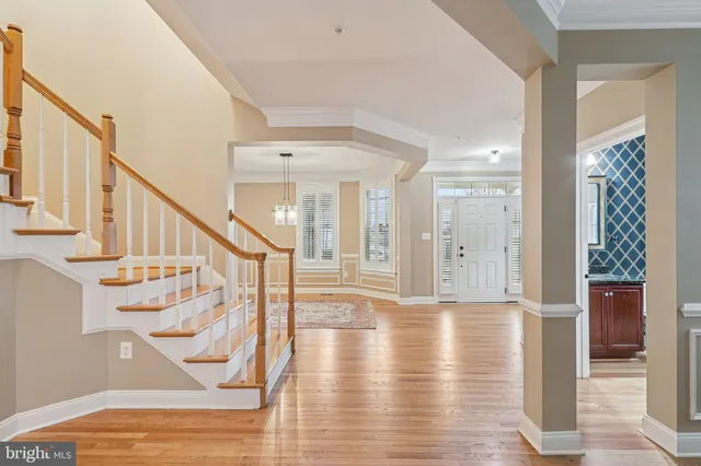 a kitchen with stainless steel appliances granite countertop a sink stove and wooden cabinets