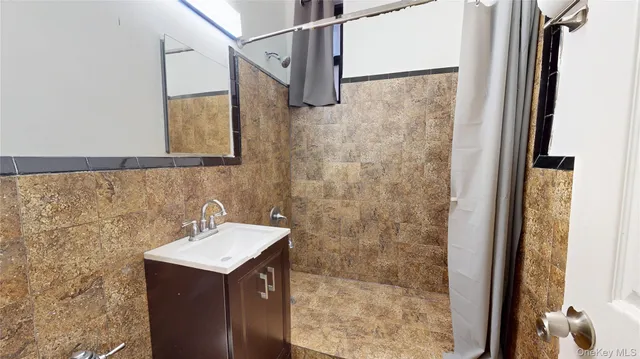 a bathroom with a sink and mirror