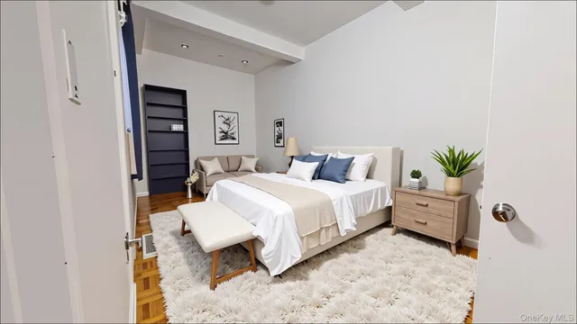 a bedroom with a bed and a couch