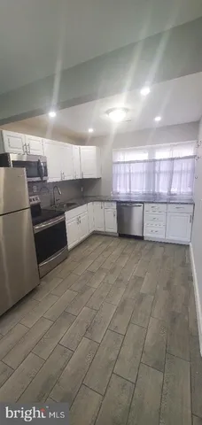 a view of a refrigerator in a kitchen