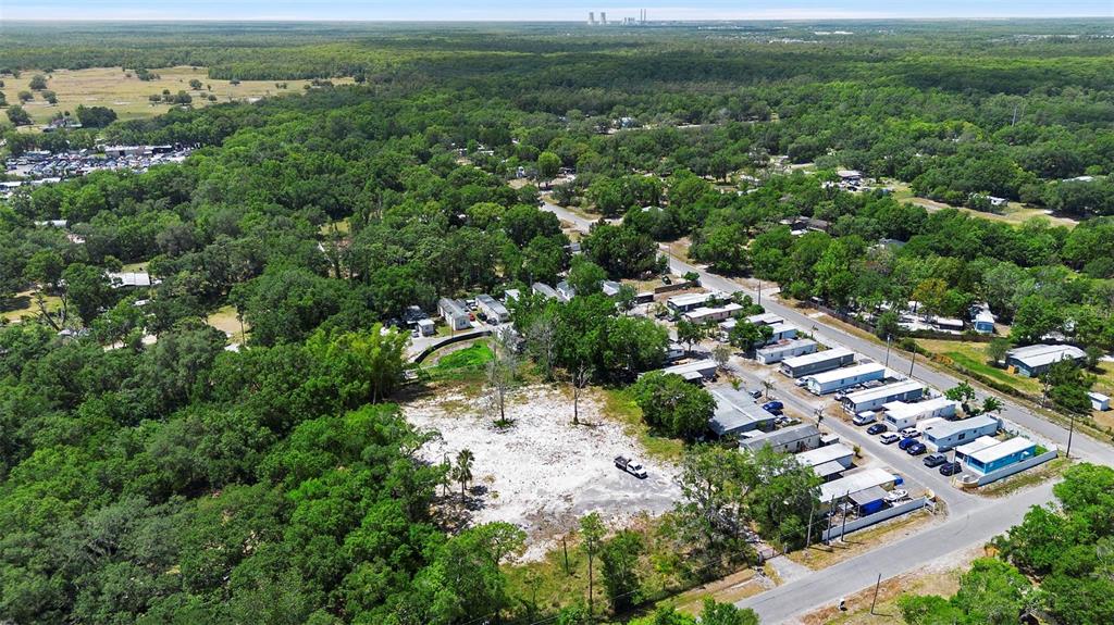 17520 Evans Trail Orlando, FL 32833 - Photo 6 of 11 an aerial view of residential houses with outdoor space and trees