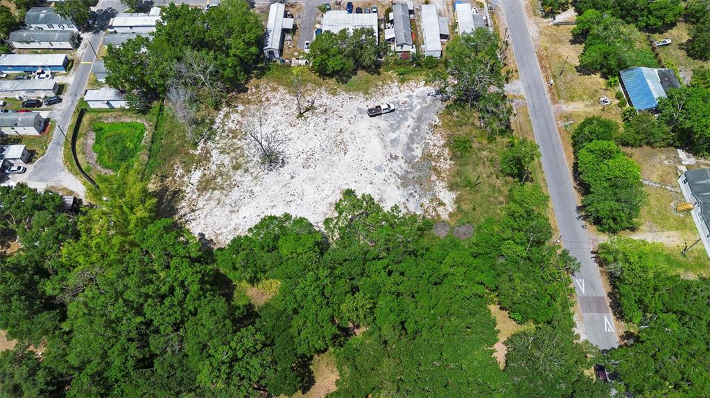 17520 Evans Trail Orlando, FL 32833 - Photo 7 of 11 an aerial view of a house with a yard and trees all around