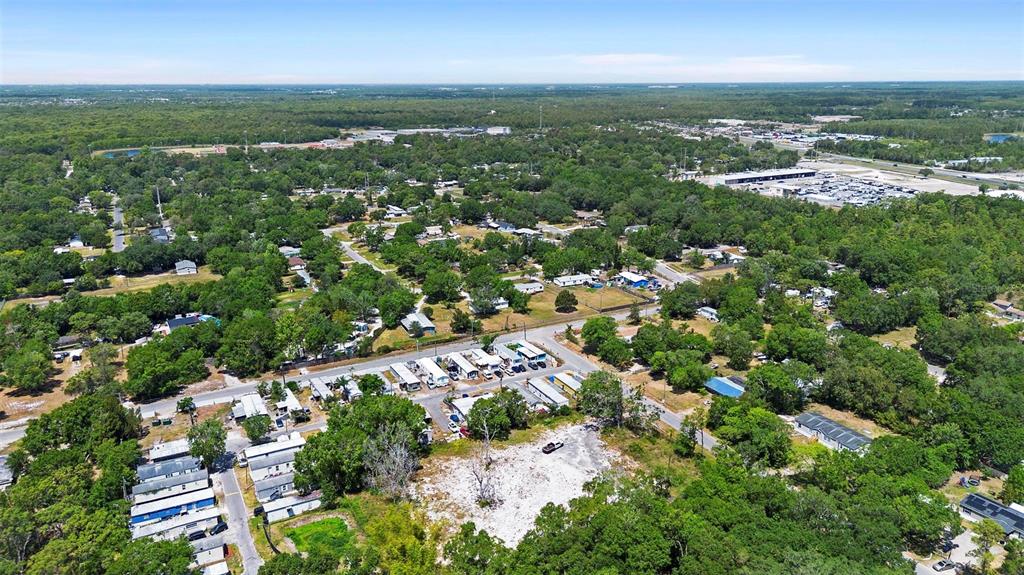 17520 Evans Trail Orlando, FL 32833 - Photo 8 of 11 an aerial view of residential houses with outdoor space and trees