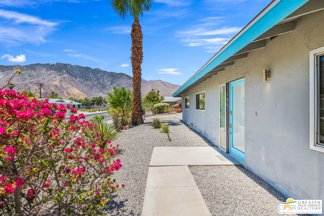 490 East Molino Road Palm Springs, CA 92262 - Photo 11 of 47 a porch with flowers and flowers