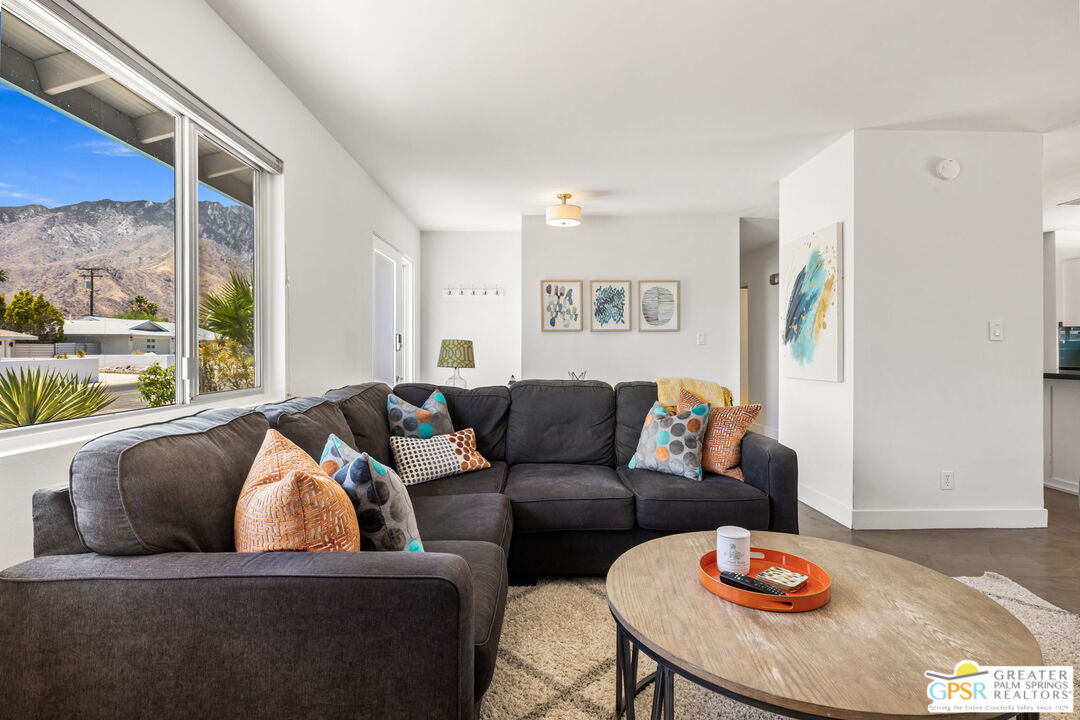 490 East Molino Road Palm Springs, CA 92262 - Photo 13 of 47 a living room with furniture and wooden floor