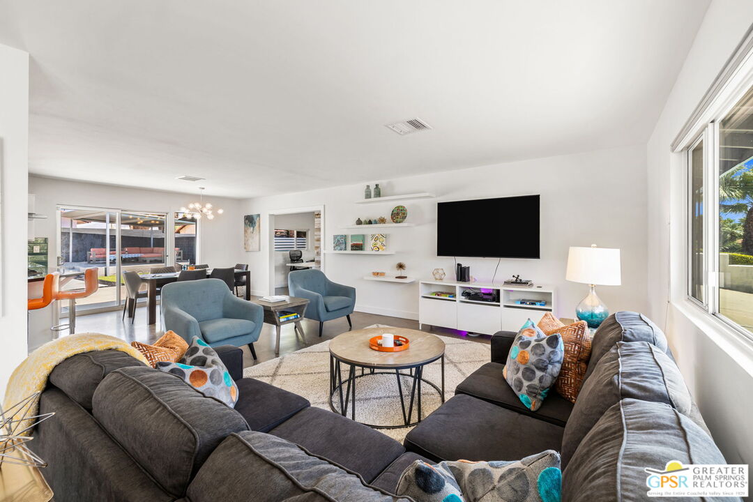 490 East Molino Road Palm Springs, CA 92262 - Photo 14 of 47 a living room with furniture and a flat screen tv