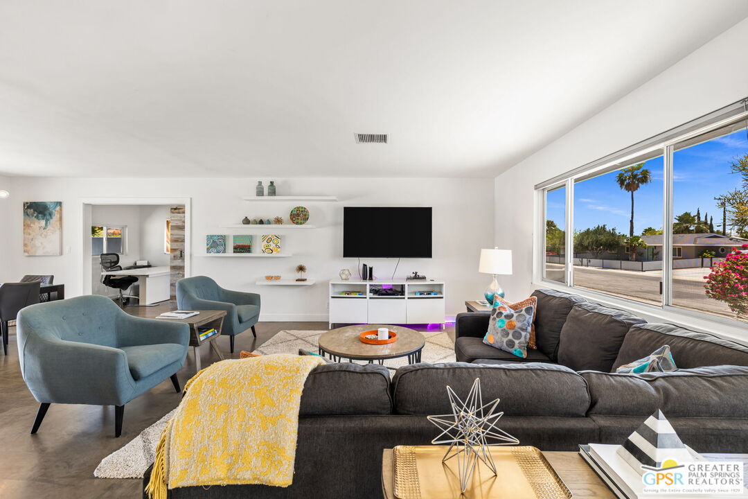 490 East Molino Road Palm Springs, CA 92262 - Photo 15 of 47 a living room with furniture and a flat screen tv