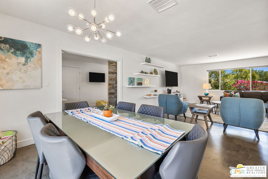 490 East Molino Road Palm Springs, CA 92262 - Photo 21 of 47 a view of a dining room with furniture window and wooden floor