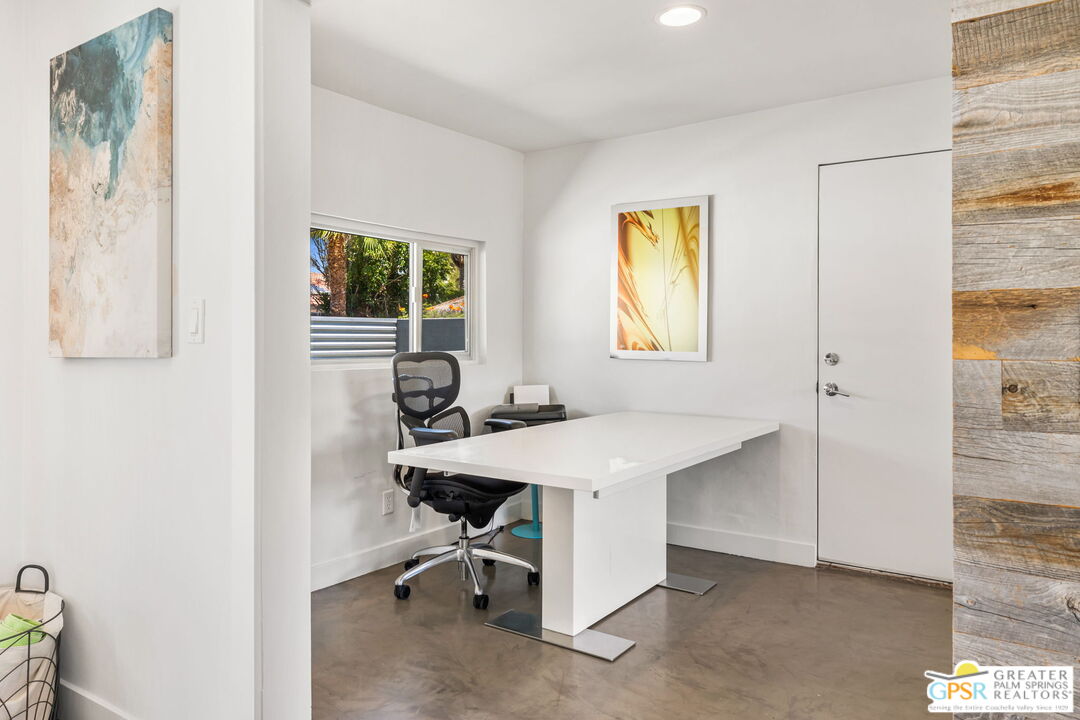 490 East Molino Road Palm Springs, CA 92262 - Photo 29 of 47 a view of a workspace with furniture and a window