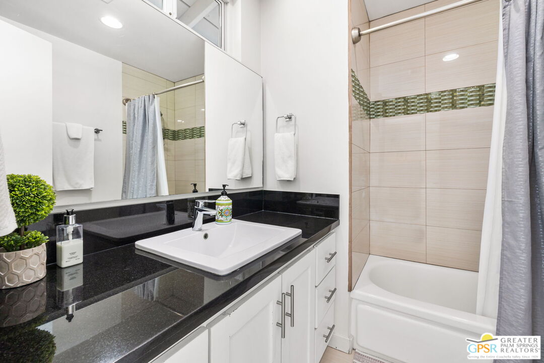 490 East Molino Road Palm Springs, CA 92262 - Photo 34 of 47 a bathroom with a sink and a mirror