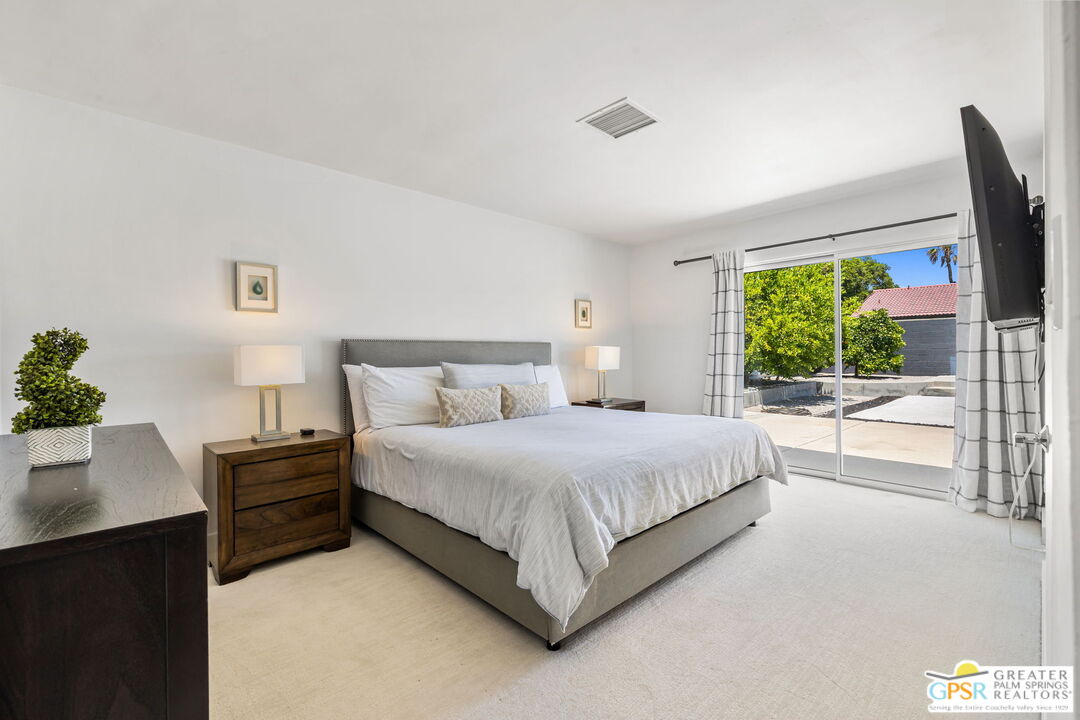 490 East Molino Road Palm Springs, CA 92262 - Photo 35 of 47 a bedroom with a bed and a window