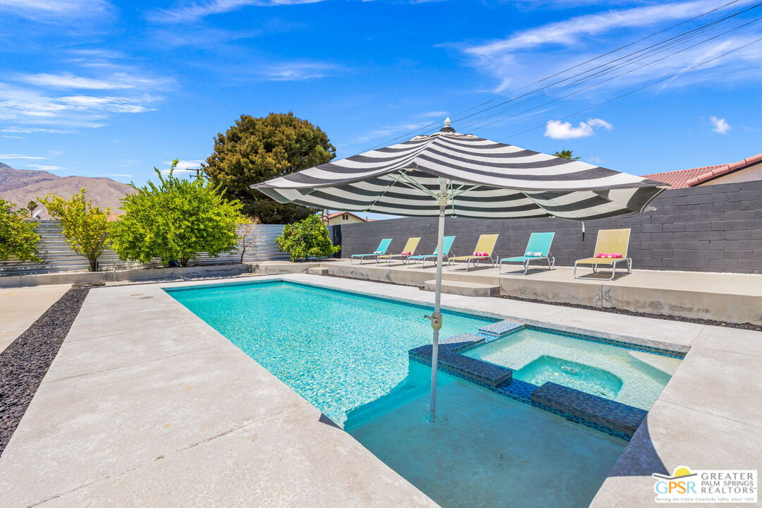 490 East Molino Road Palm Springs, CA 92262 - Photo 37 of 47 a view of a house with pool and chairs