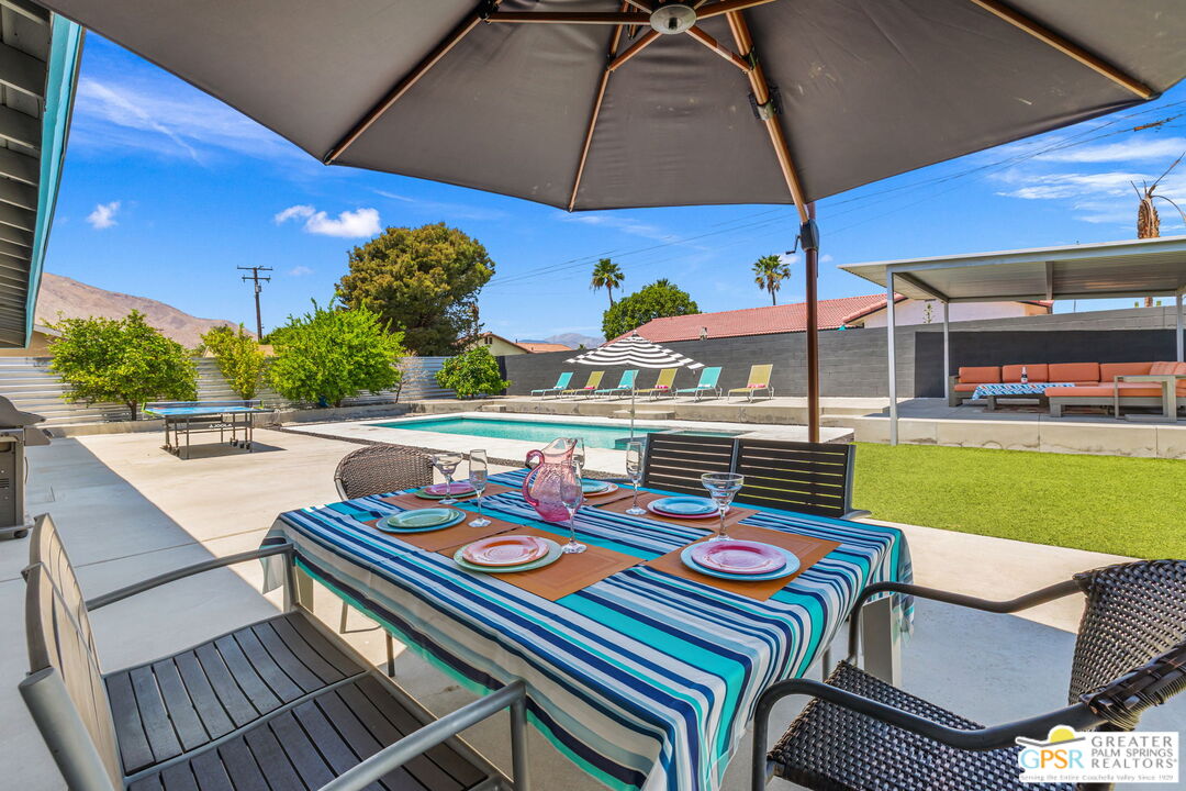 490 East Molino Road Palm Springs, CA 92262 - Photo 41 of 47 a table and chairs in the patio