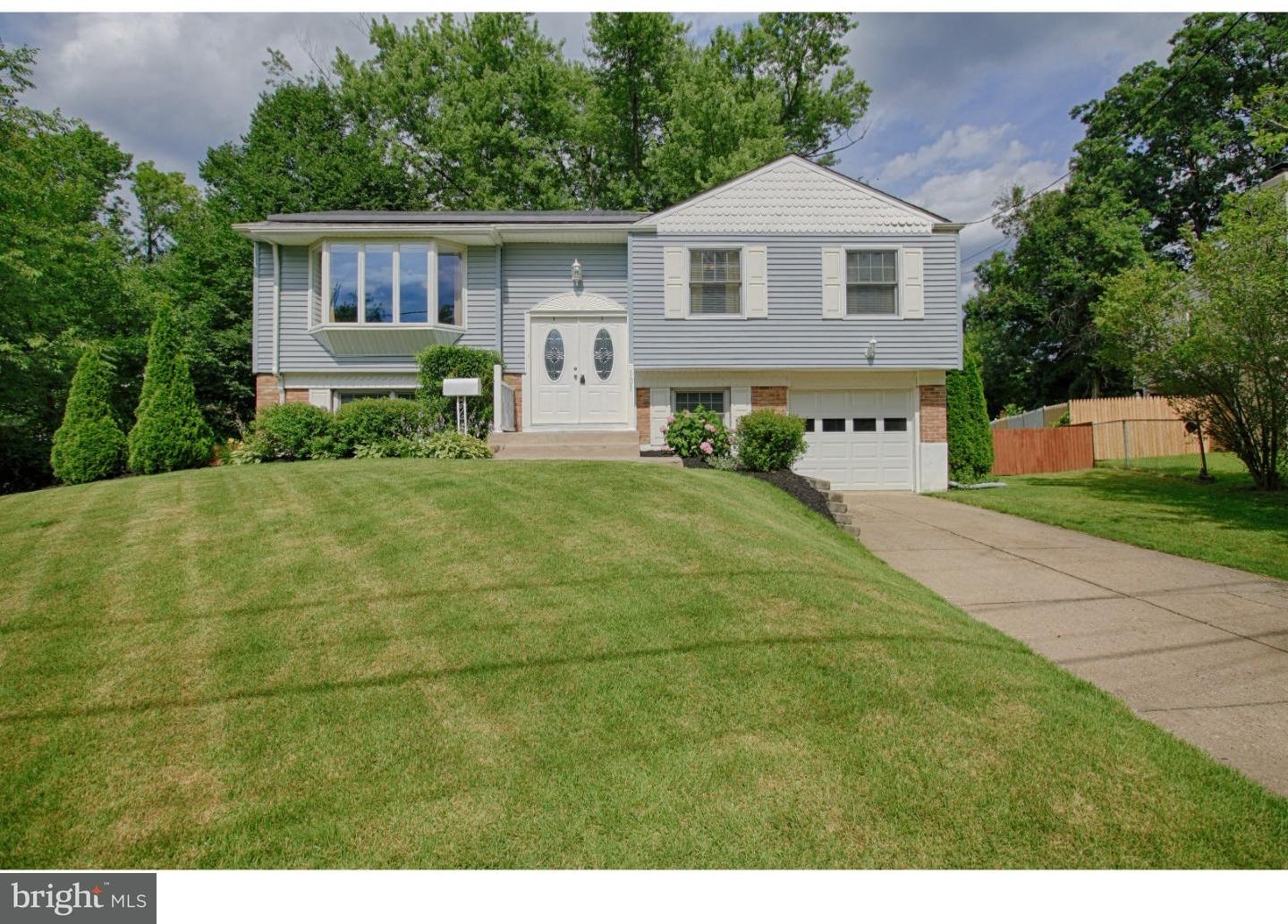 101 Round Hill Road Voorhees, NJ 08043 - Photo 1 of 25 a front view of a house with yard and green space