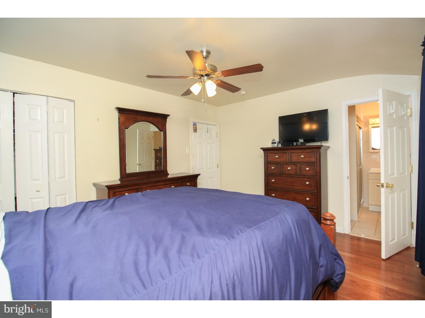101 Round Hill Road Voorhees, NJ 08043 - Photo 13 of 25 a bedroom with a bed and a flat screen tv