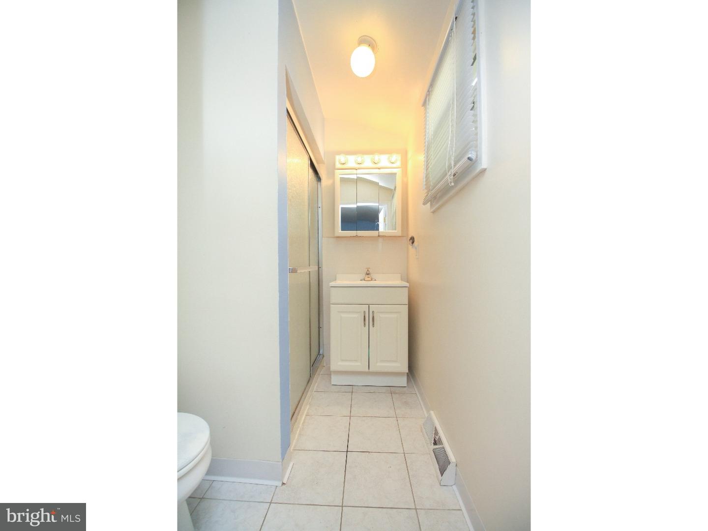 101 Round Hill Road Voorhees, NJ 08043 - Photo 14 of 25 a bathroom with a sink and a mirror