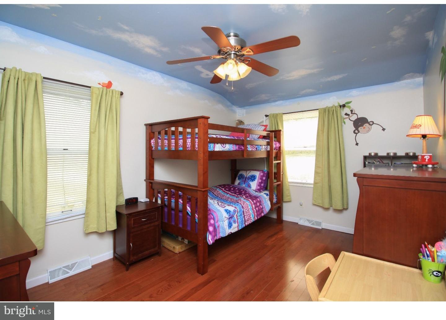 101 Round Hill Road Voorhees, NJ 08043 - Photo 15 of 25 a bedroom with a bed and a chandelier