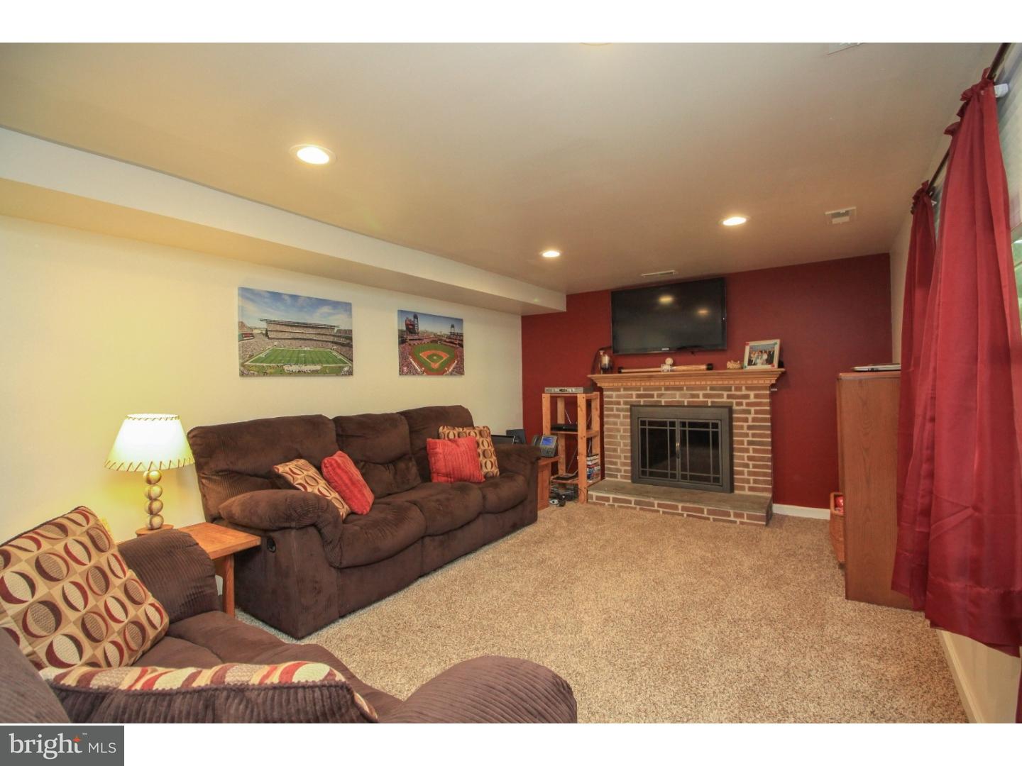101 Round Hill Road Voorhees, NJ 08043 - Photo 22 of 25 a living room with furniture a fireplace and kitchen view