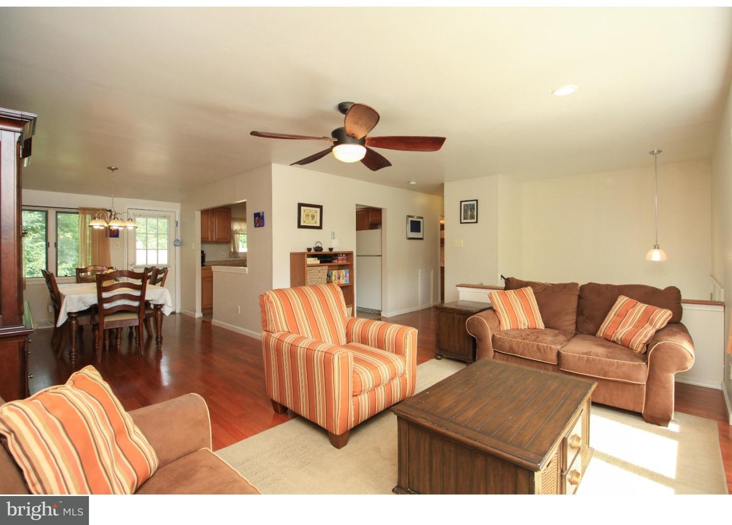 101 Round Hill Road Voorhees, NJ 08043 - Photo 5 of 25 a living room with furniture ceiling fan and a rug