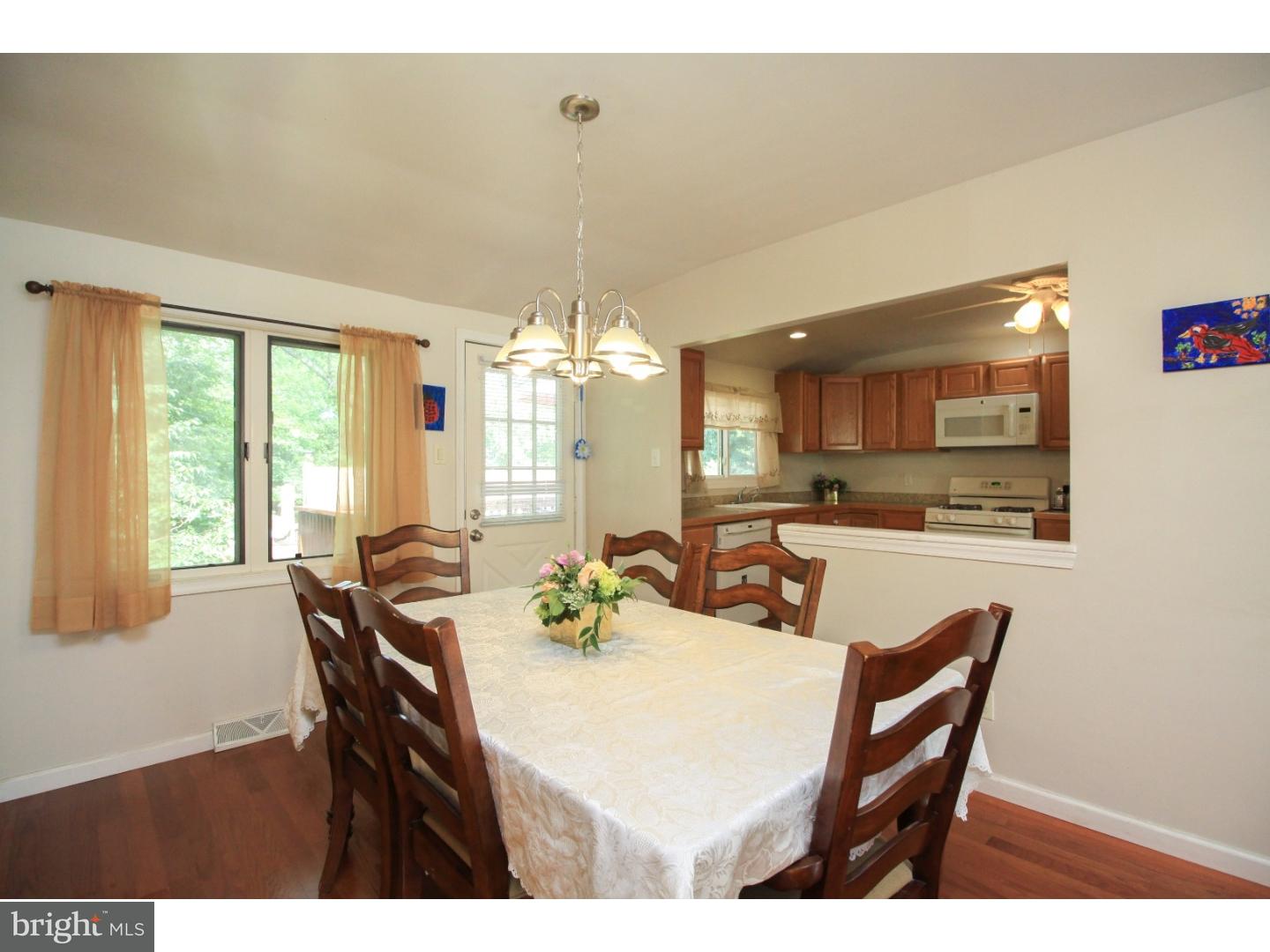 101 Round Hill Road Voorhees, NJ 08043 - Photo 7 of 25 a view of a dining room with furniture and chandelier