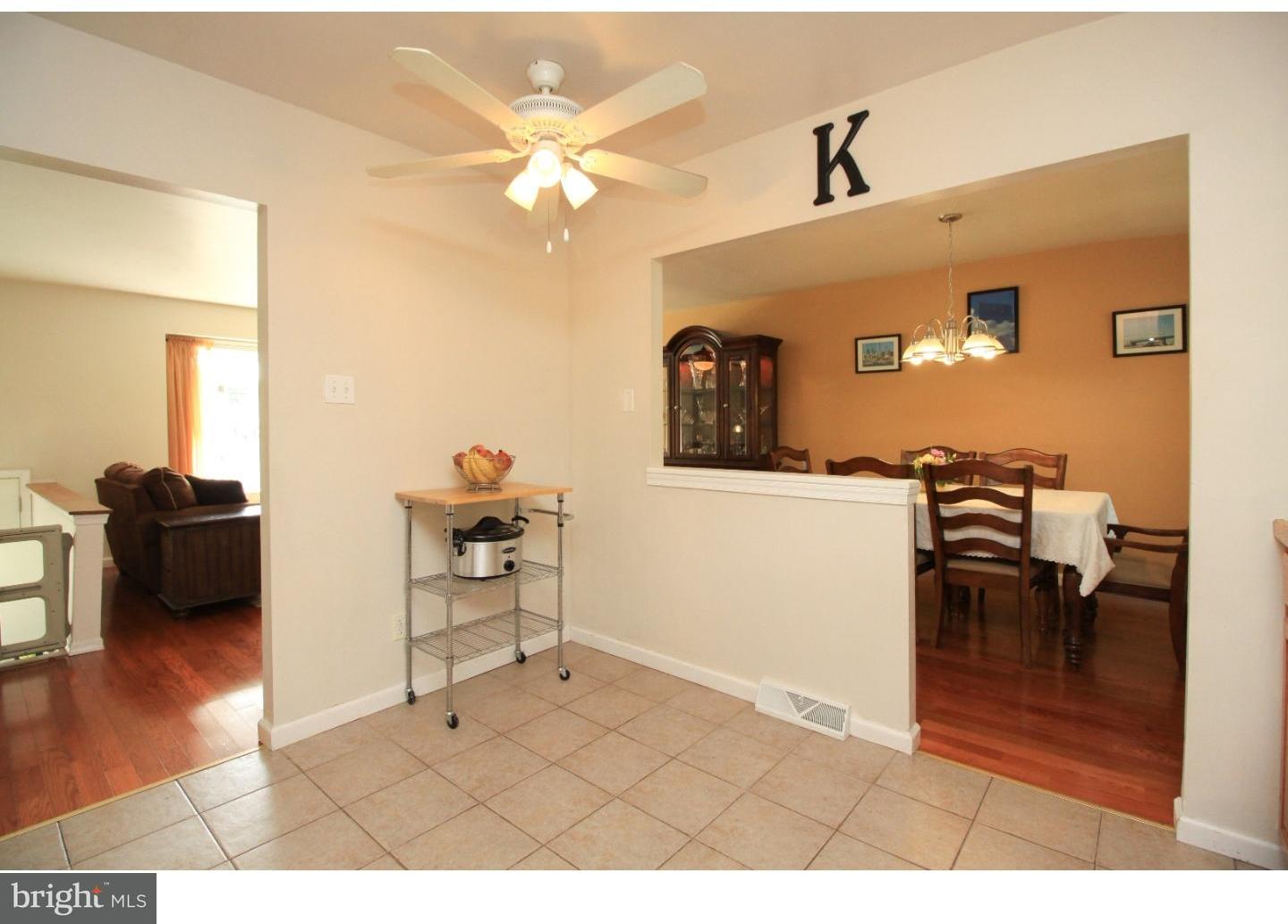 101 Round Hill Road Voorhees, NJ 08043 - Photo 10 of 25 a living room with furniture and a dining table
