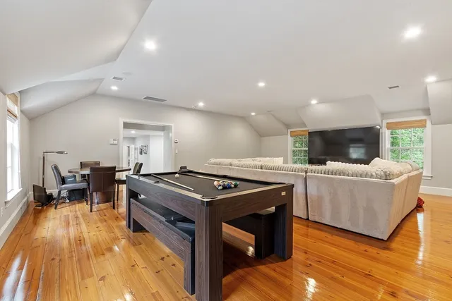 a kitchen with stainless steel appliances granite countertop a stove and a wooden floors