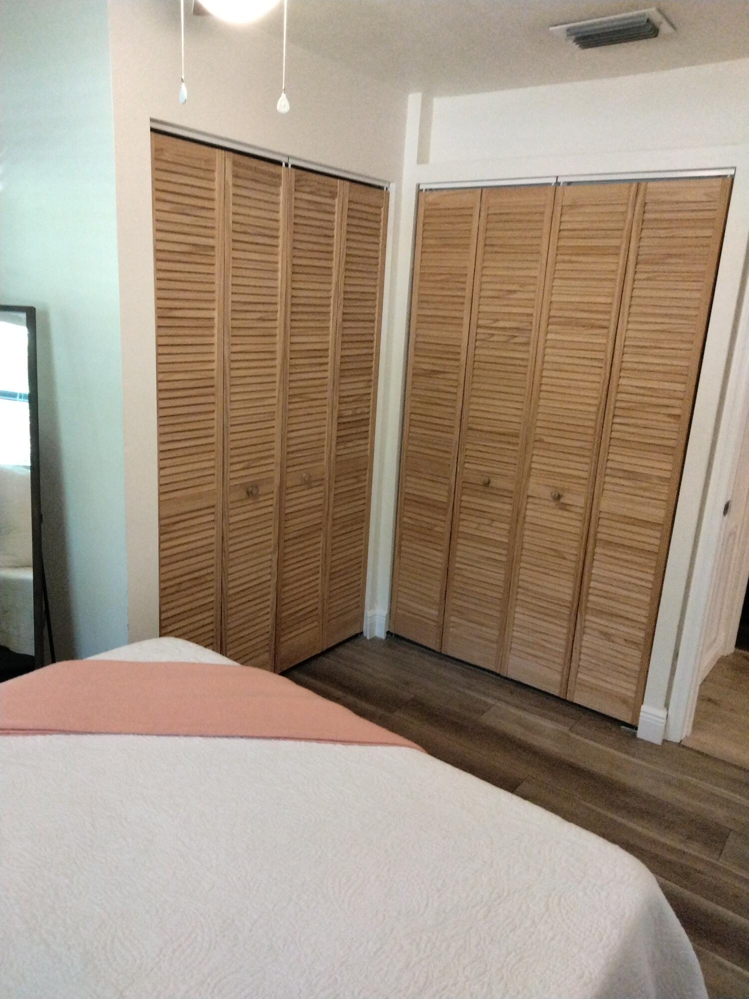 1150 Northeast County Line Road Jensen Beach, FL 34957 - Photo 11 of 17 a view of a room with an empty space and a window