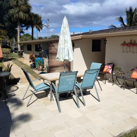a view of a chairs and tables in patio