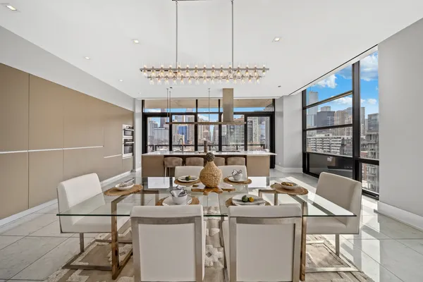 a view of a dining room with furniture window and outside view