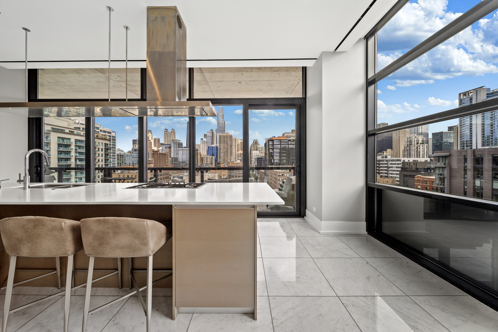 400 West Huron Street, Unit 1001 Chicago, IL 60654 - Photo 18 of 41 a open kitchen with granite countertop a coffee table and chairs