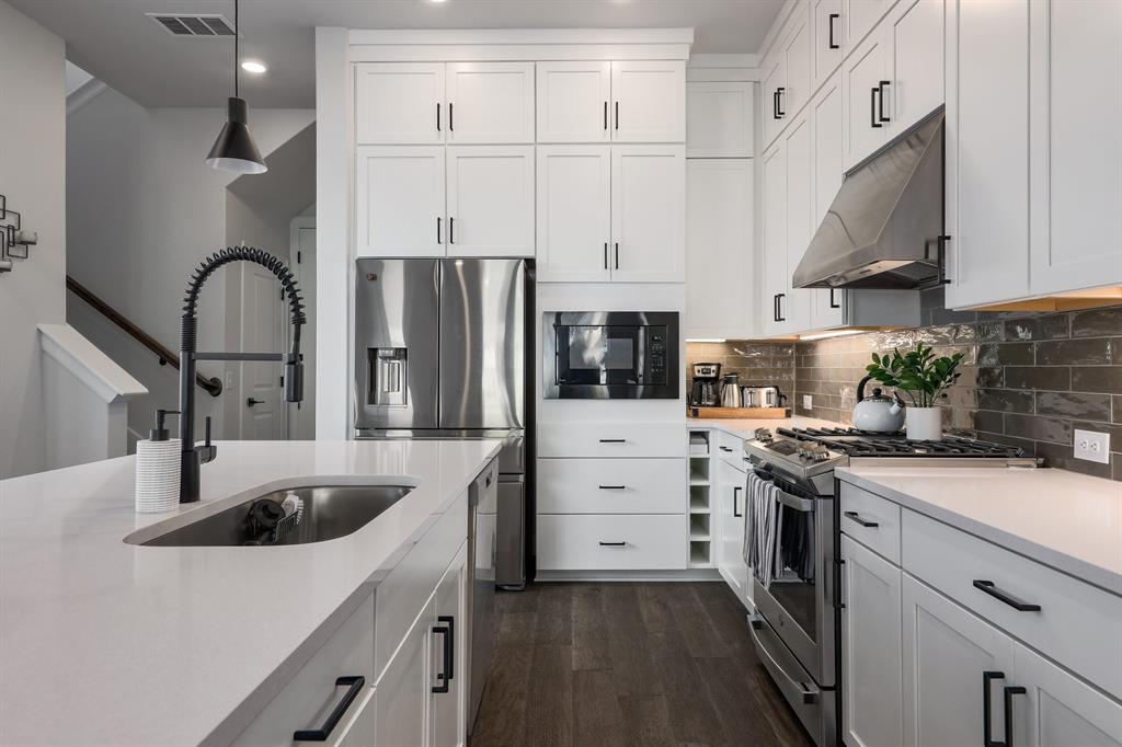3907 Tilley Street Austin, TX 78723 - Photo 7 of 26 a kitchen with appliances a sink and cabinets