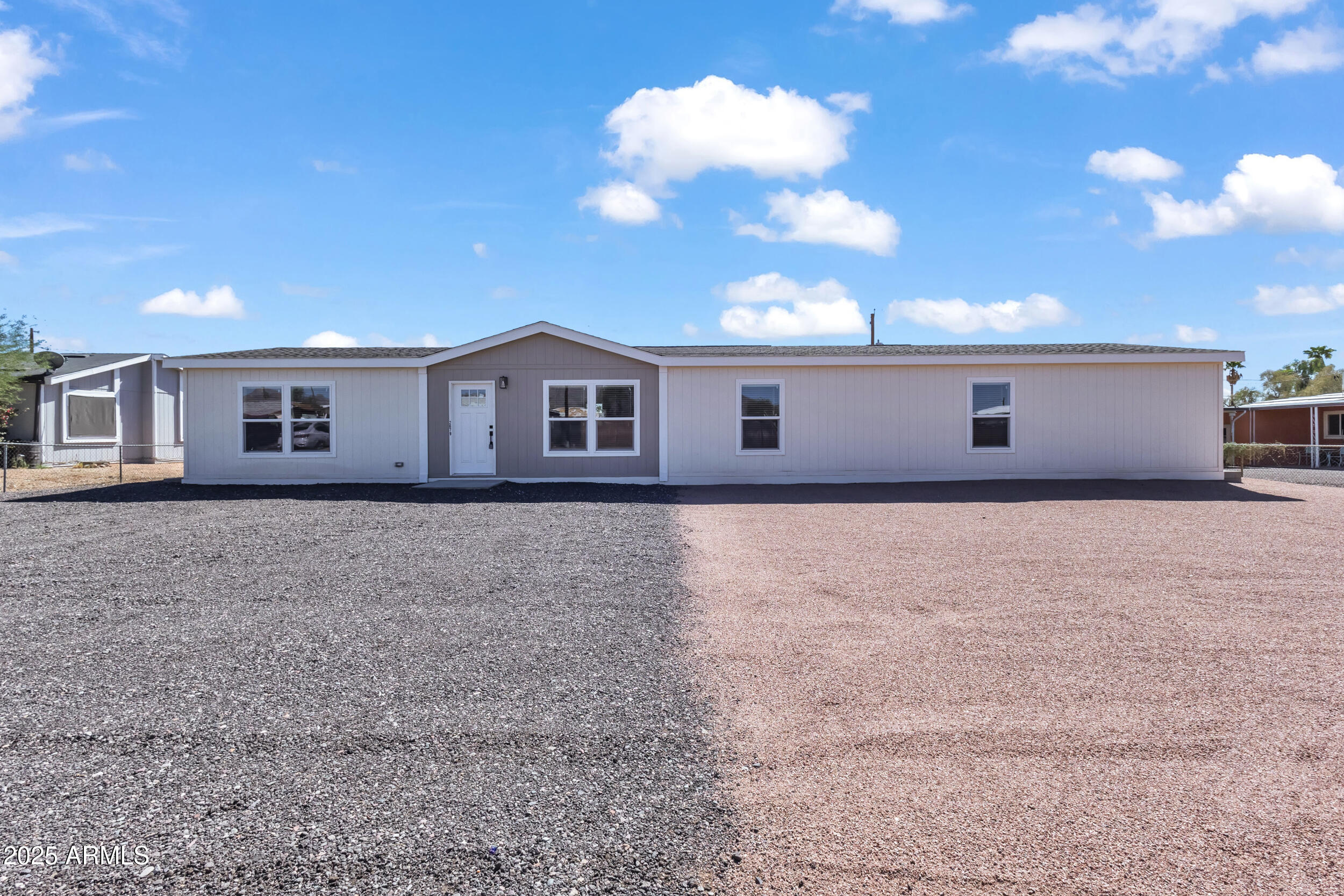 a view of a house with a backyard