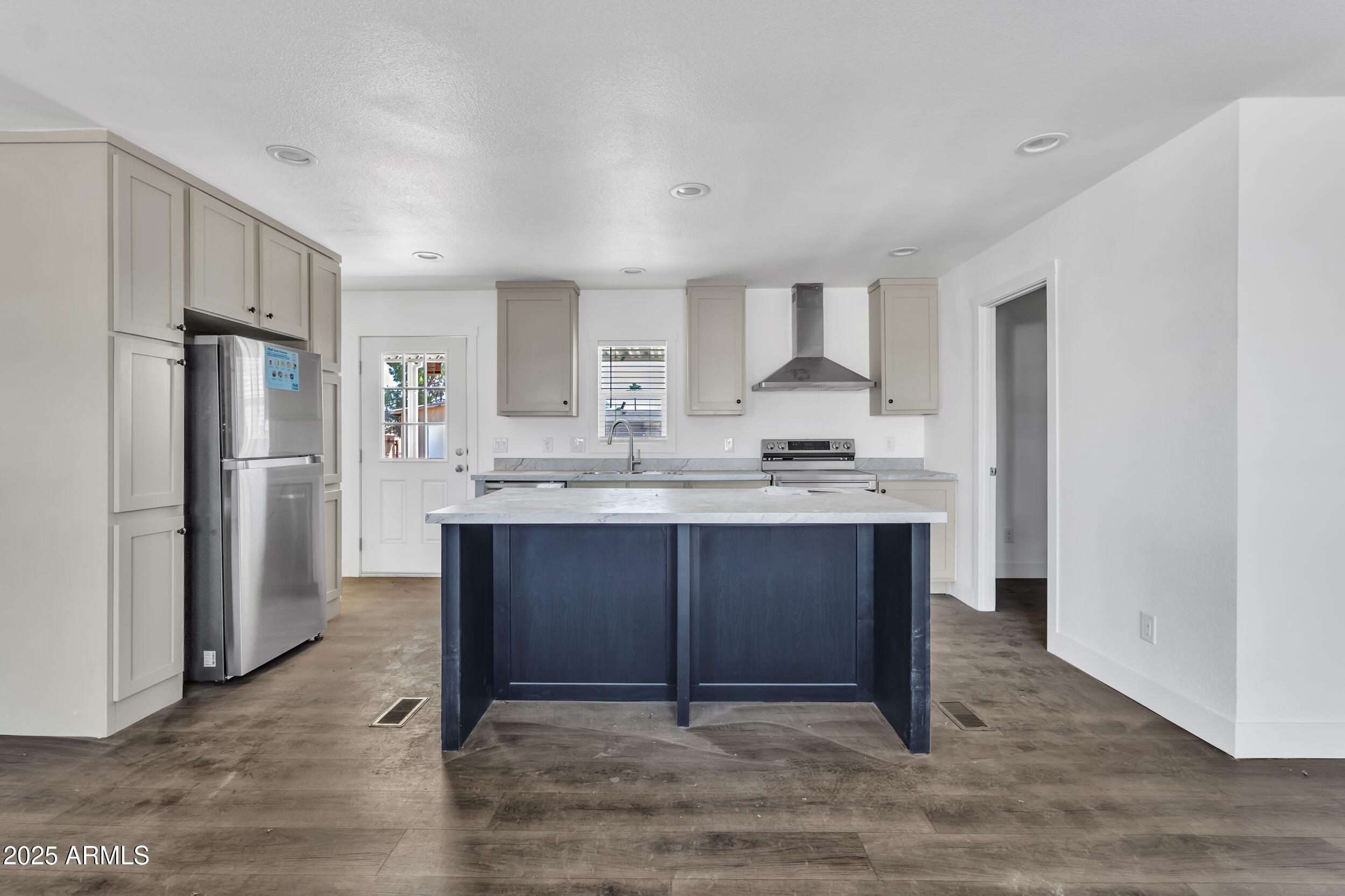 2679 West Manzanita Street Apache Junction, AZ 85120 - Photo 2 of 8 a kitchen with stainless steel appliances granite countertop a refrigerator and a stove
