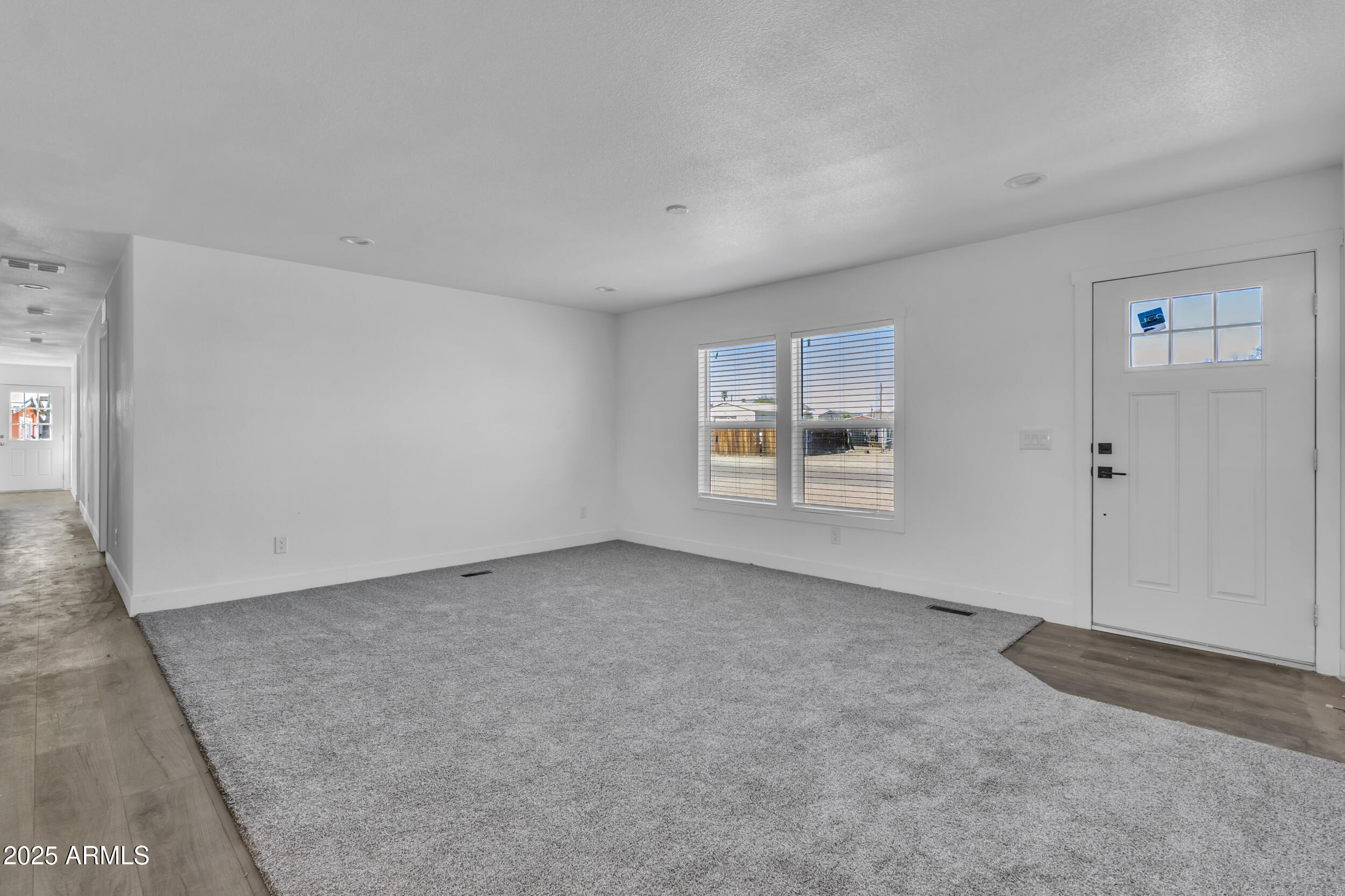 2679 West Manzanita Street Apache Junction, AZ 85120 - Photo 4 of 8 a view of an empty room with a window