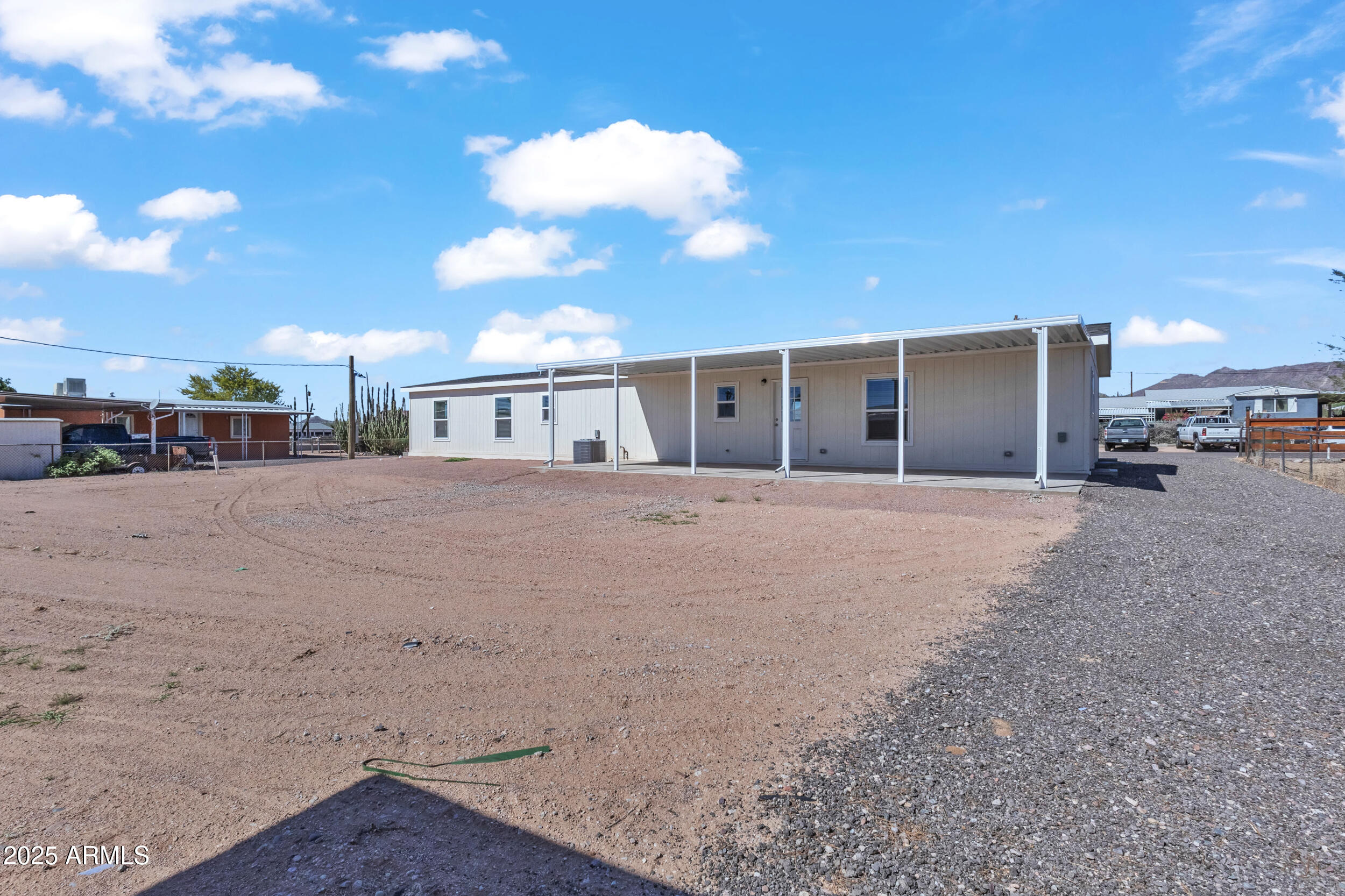2679 West Manzanita Street Apache Junction, AZ 85120 - Photo 8 of 8 a backyard of a house with wooden floor