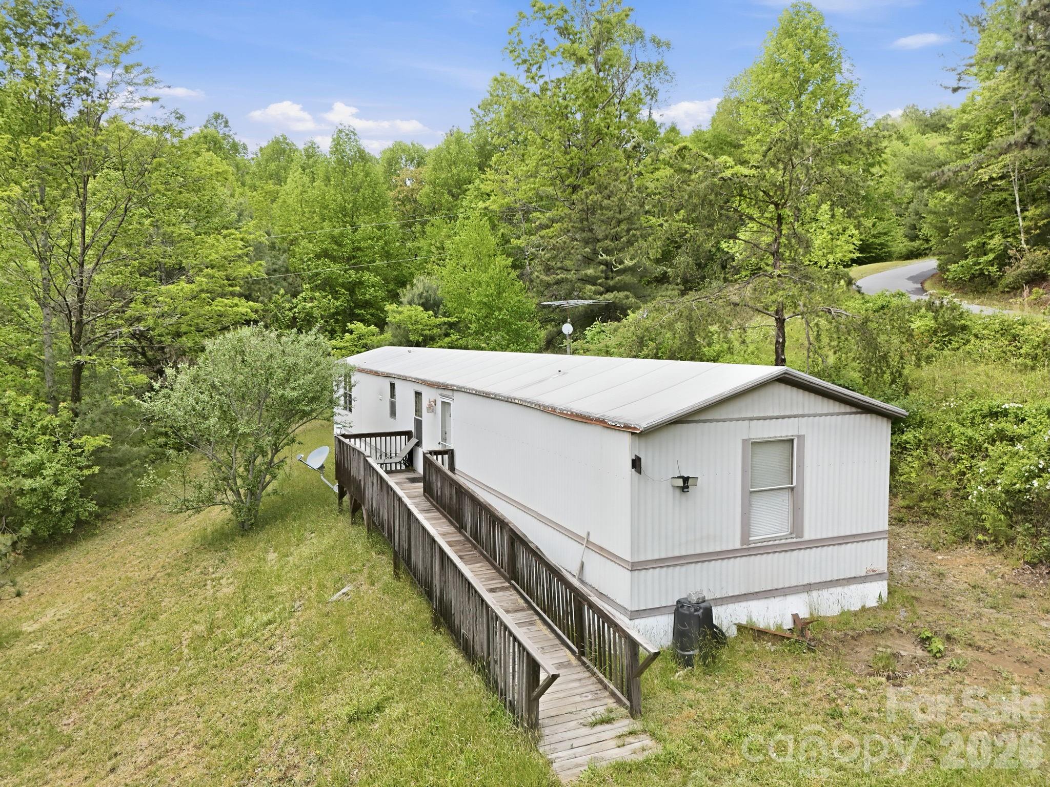 4105 Pinnacle Mountain Road Zirconia, NC 28790 - Photo 16 of 23 a house with trees in the background