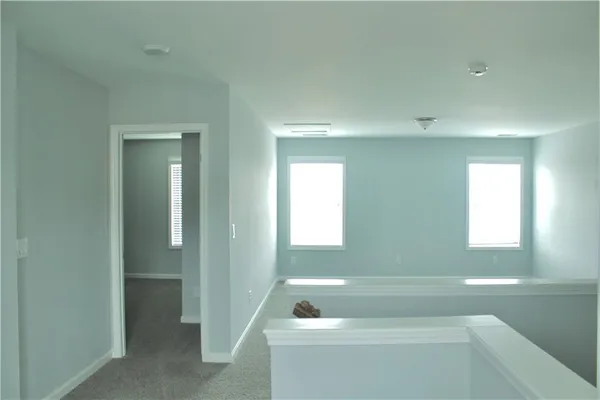 a bathroom with a bathtub and a window