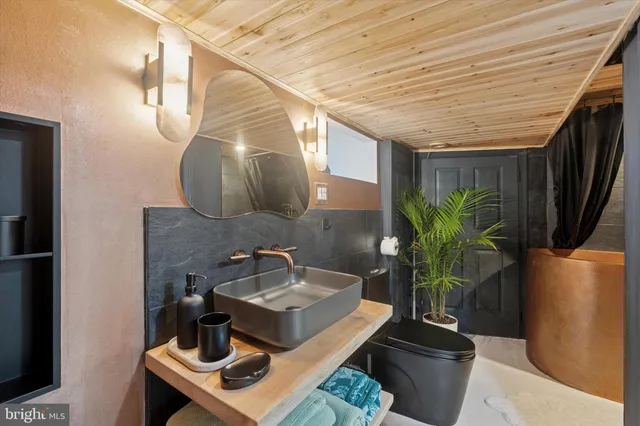 a bathroom with a sink and mirror