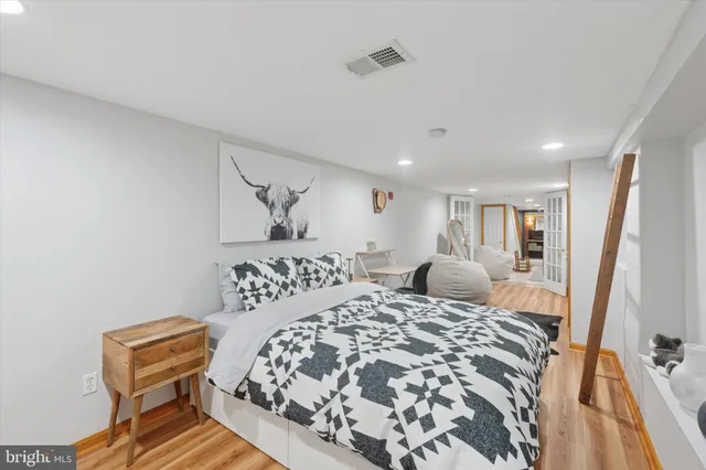 a bedroom with a bed and a chair