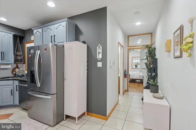 a white refrigerator freezer sitting in a kitchen