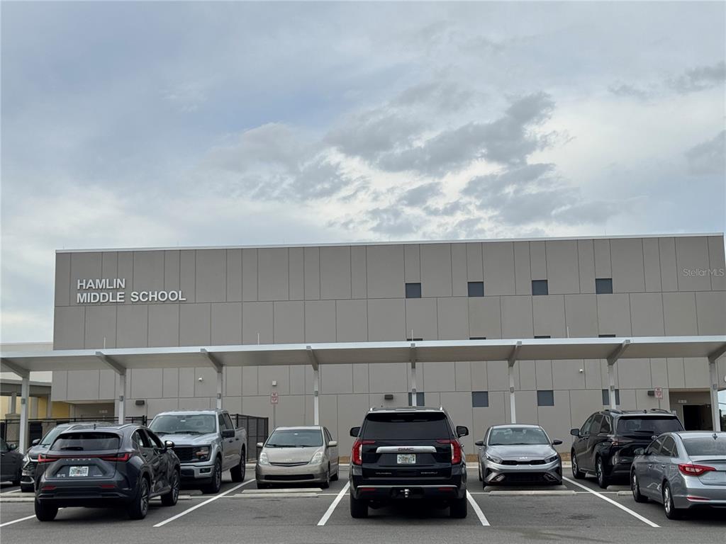 16434 Hamlin Hills Road Winter Garden, FL 34787 - Photo 49 of 50 a car parked in parking