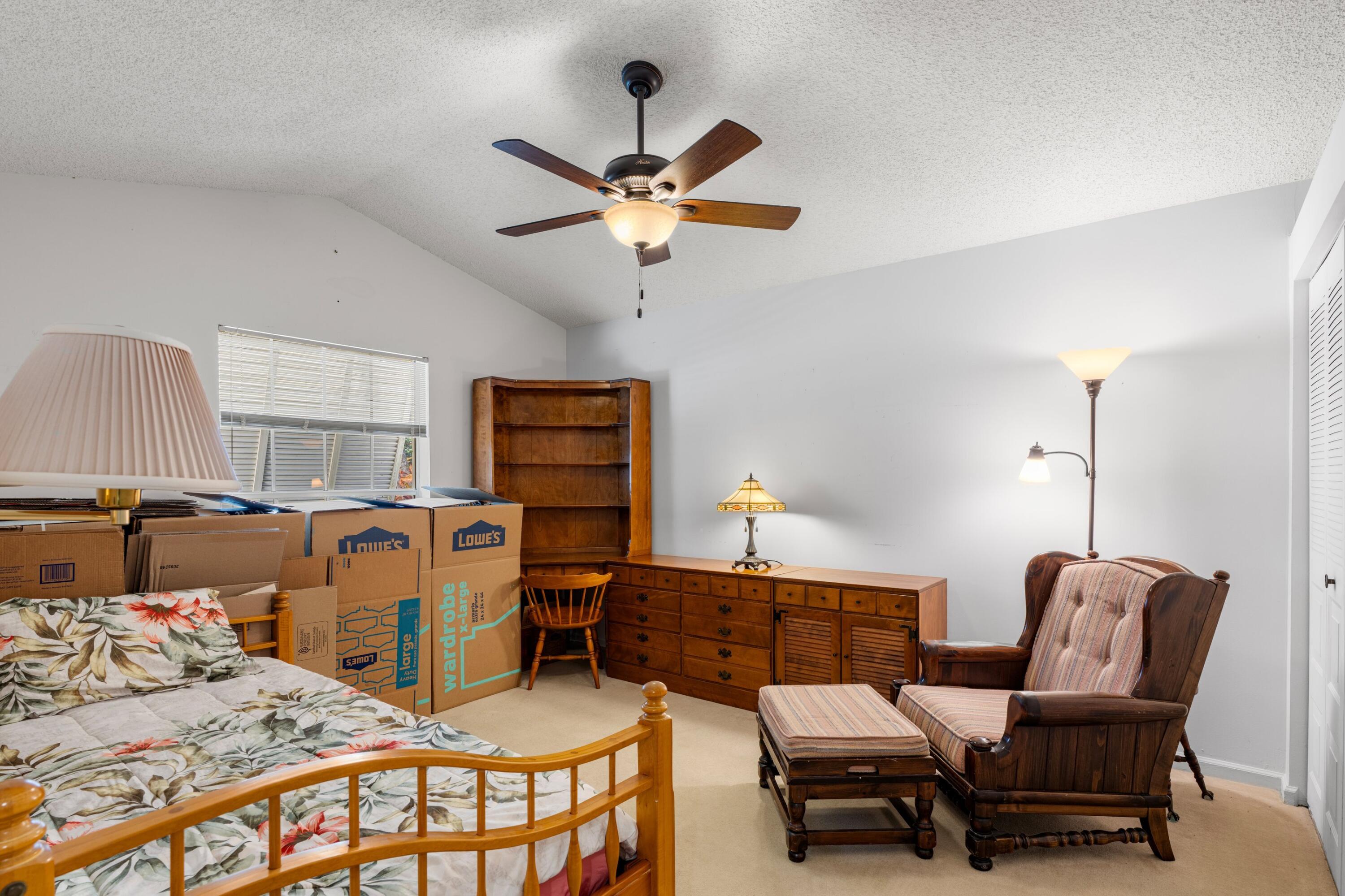 7676 Kings Ride Boynton Beach, FL 33436 - Photo 14 of 41 a bedroom with furniture and a window