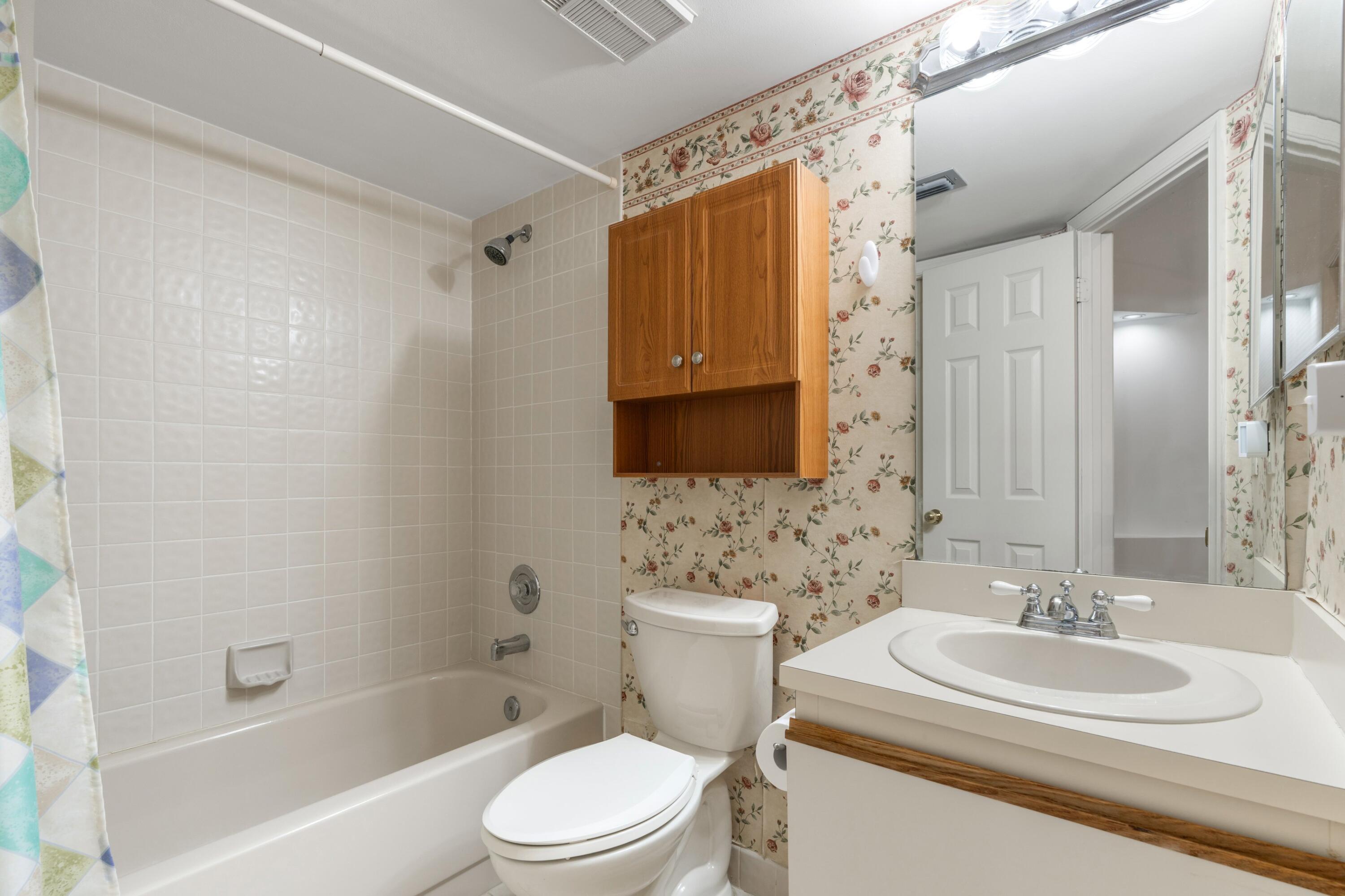 7676 Kings Ride Boynton Beach, FL 33436 - Photo 15 of 41 a bathroom with a sink a toilet and shower