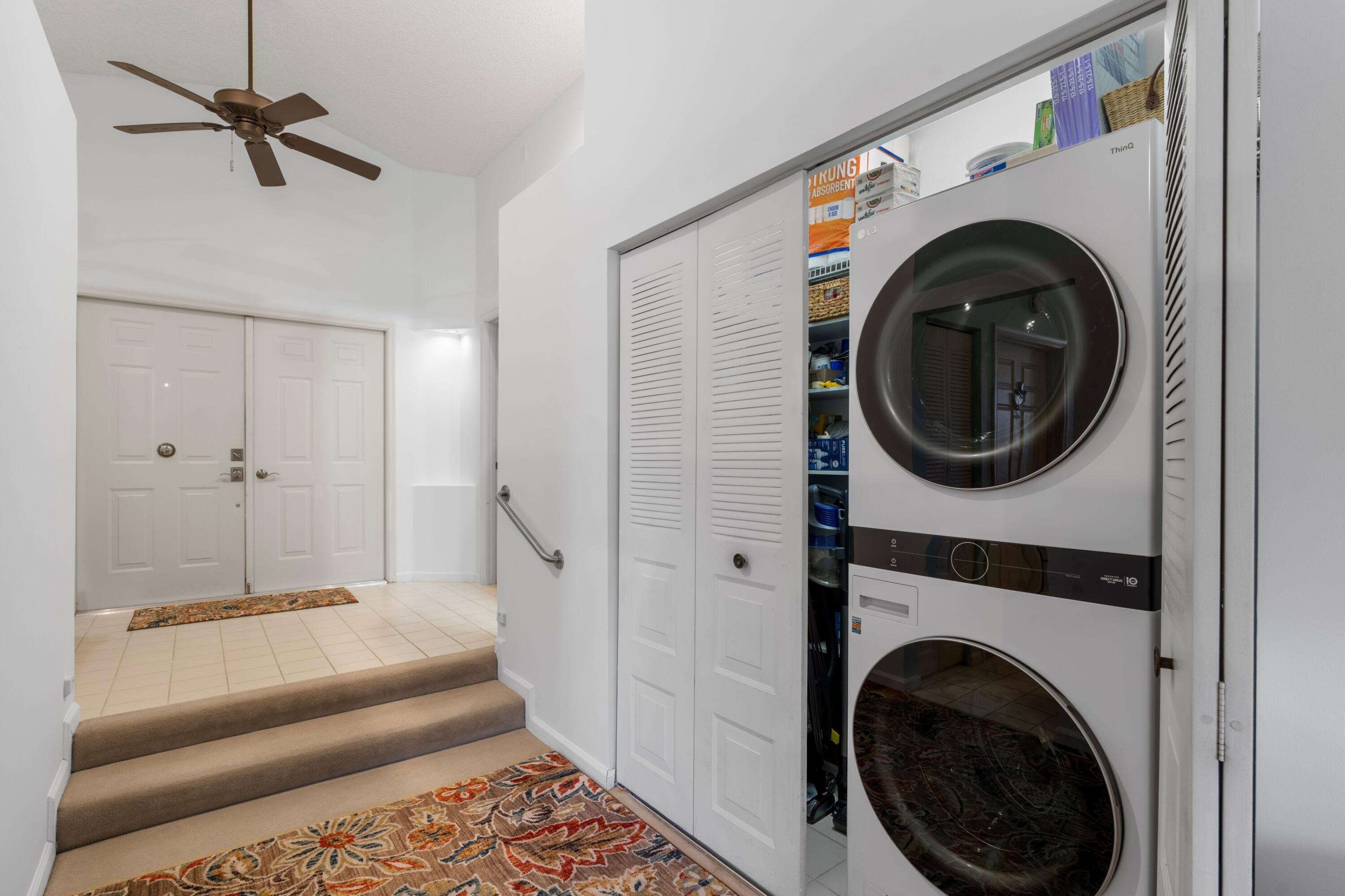 7676 Kings Ride Boynton Beach, FL 33436 - Photo 16 of 41 a view of a hallway with washer and dryer