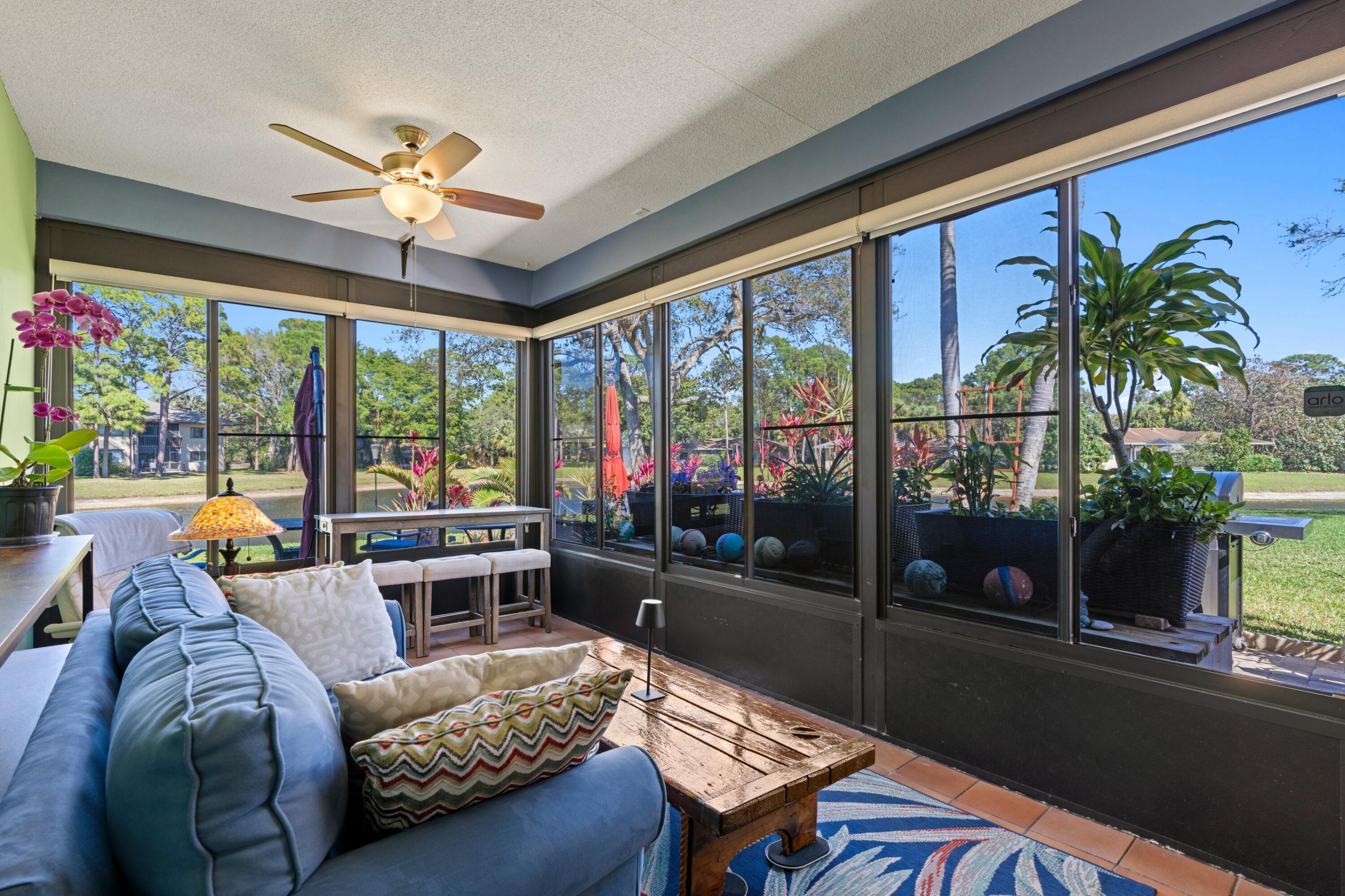 7676 Kings Ride Boynton Beach, FL 33436 - Photo 17 of 41 a living room with furniture and a floor to ceiling window